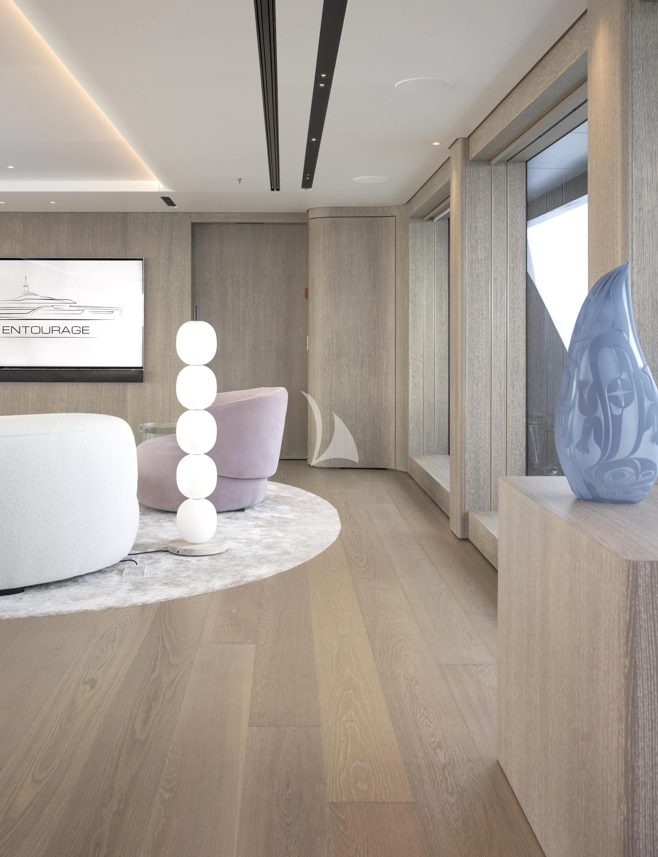 a room with a table and a lamp aboard ENTOURAGE Yacht for Sale