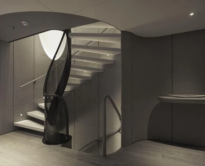 a black and white staircase aboard ENTOURAGE Yacht for Sale
