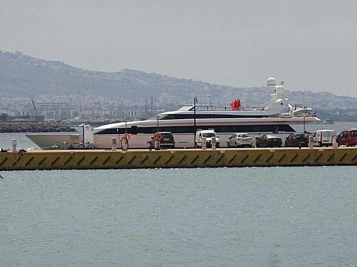 a group of cars parked in front of a plane aboard ALTAMAREA I Yacht for Sale