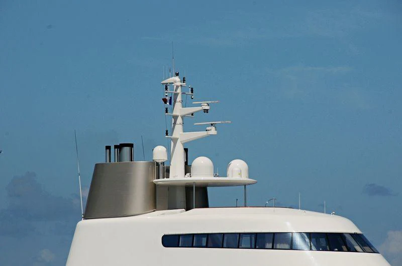 a white car with a satellite on top of it aboard A Yacht for Sale