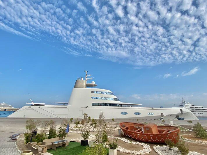 a large white ship aboard A Yacht for Sale