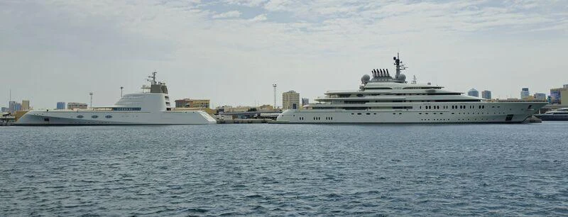 a couple of ships in the water aboard A Yacht for Sale