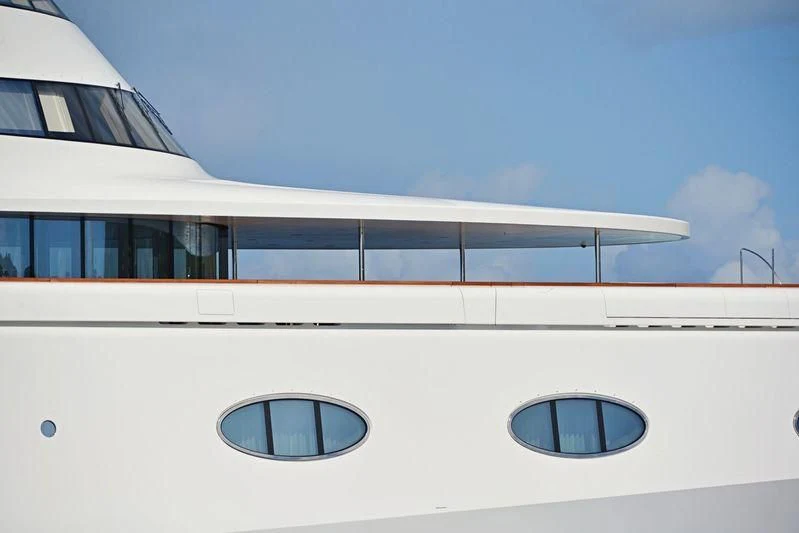 a white building with windows aboard A Yacht for Sale
