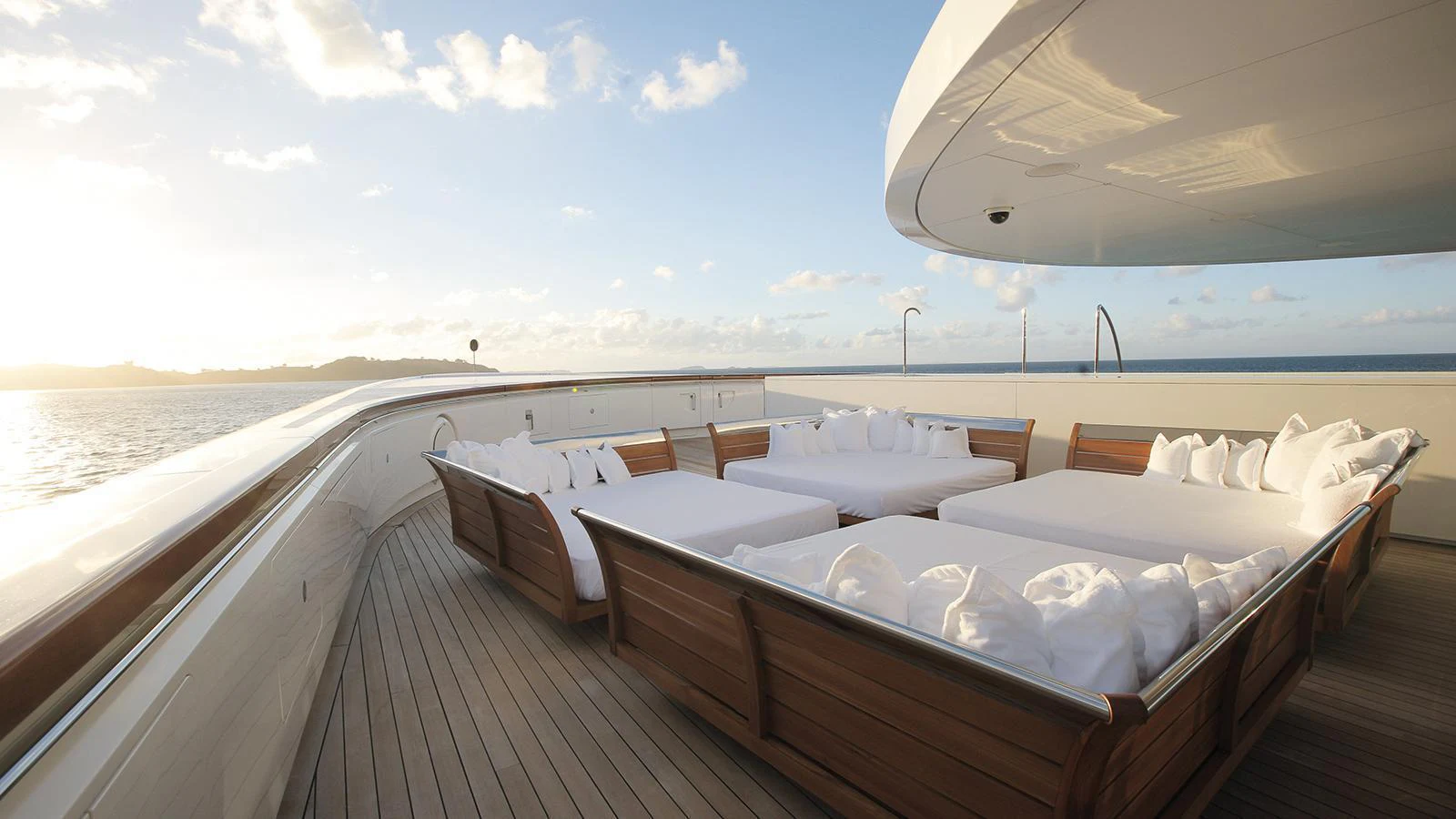 a room with a view of the ocean and the sun aboard A Yacht for Sale