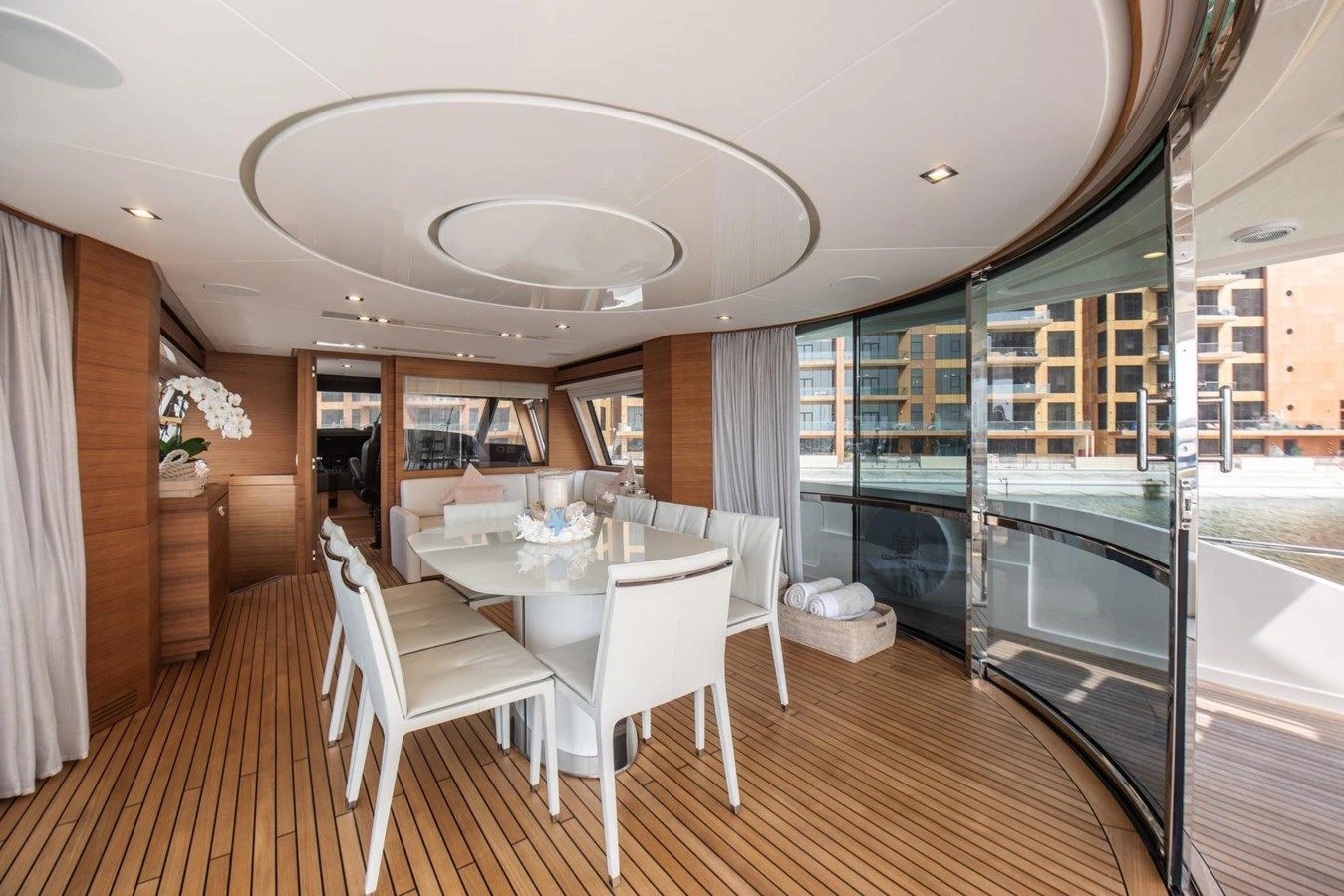 a large room with a table and chairs aboard ZEN Yacht for Sale