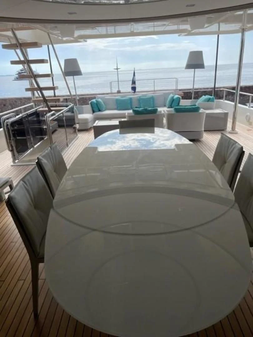 a large table with chairs around it aboard ZEN Yacht for Sale