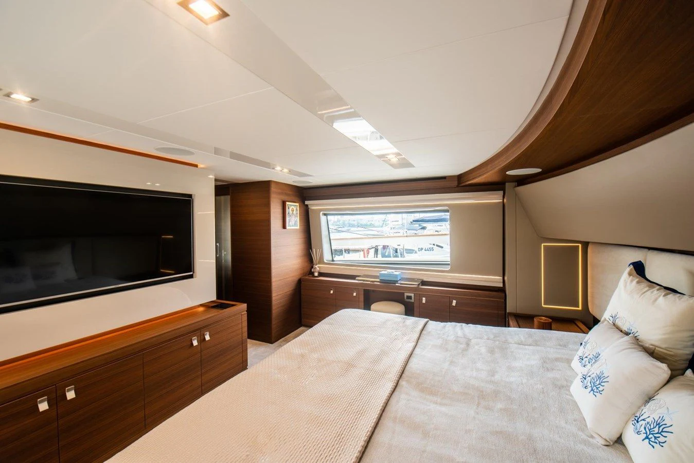 a bedroom with a large bed aboard ZEN Yacht for Sale