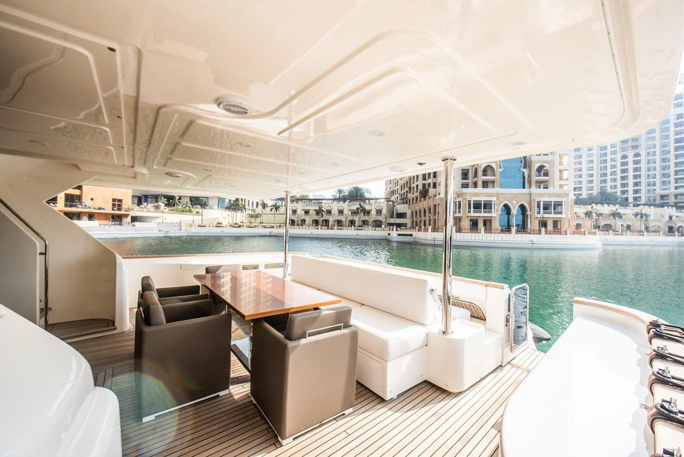 a room with a table chairs and a large window overlooking a body of water aboard ZEN Yacht for Sale