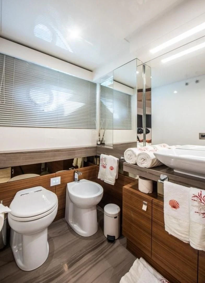 a bathroom with a toilet and sink aboard ZEN Yacht for Sale
