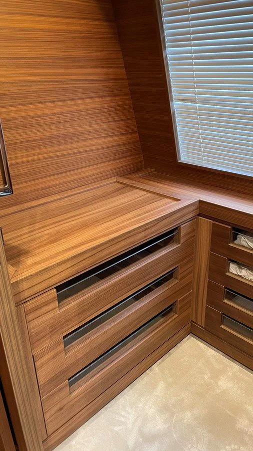 a wooden dresser with a window aboard ZEN Yacht for Sale