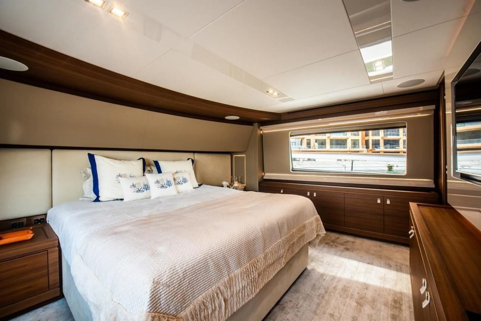 a large bedroom with a large bed aboard ZEN Yacht for Sale