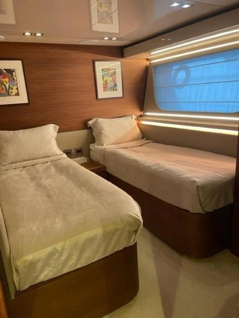 a couple of beds in a room aboard ZEN Yacht for Sale