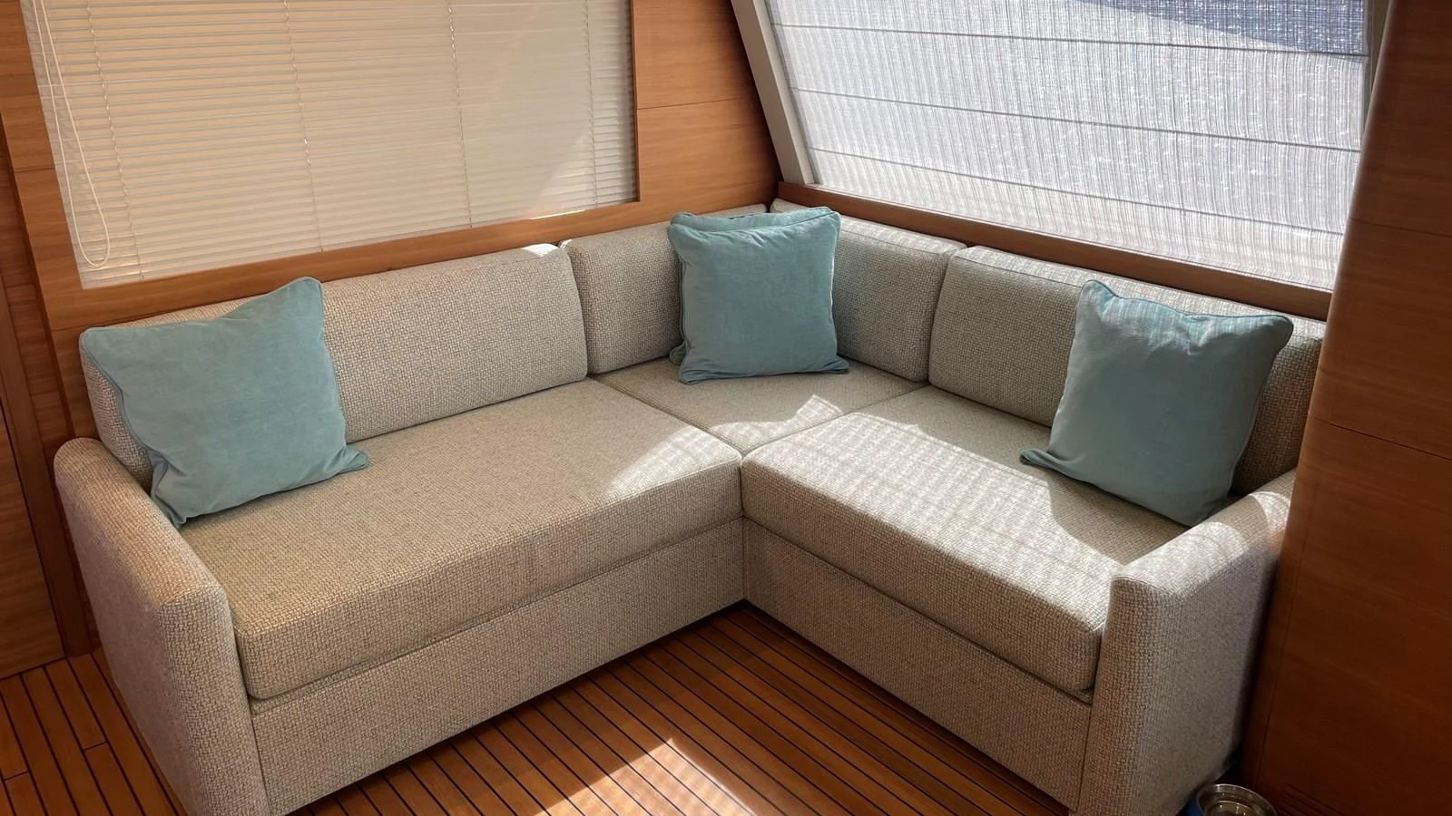 a couch with pillows on it aboard ZEN Yacht for Sale