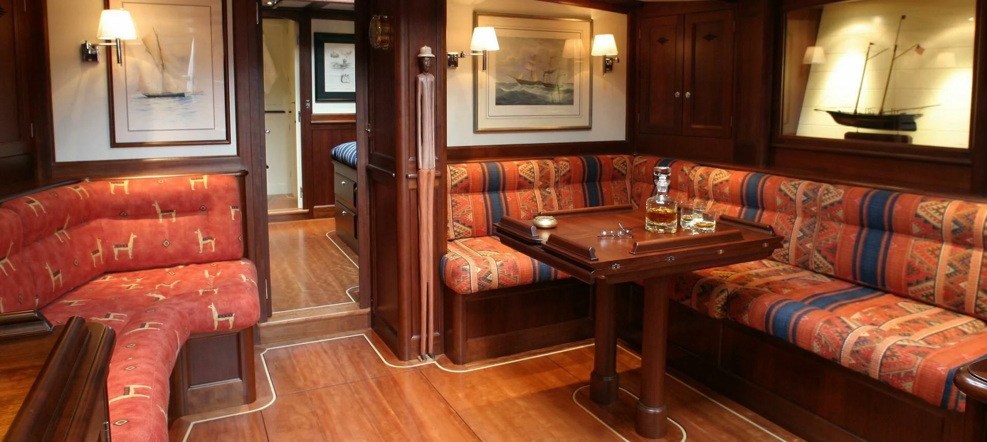 a living room with a couch and a coffee table aboard ALDEBARAN Yacht for Sale
