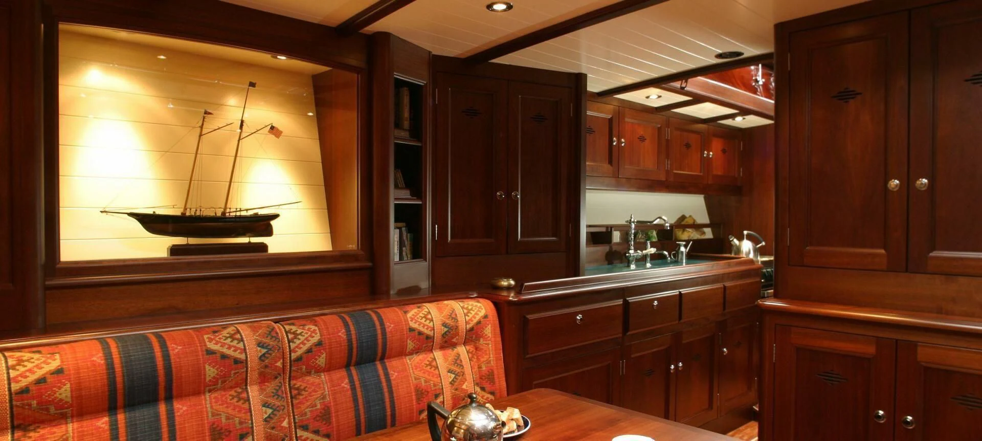 a kitchen with wooden cabinets aboard ALDEBARAN Yacht for Sale