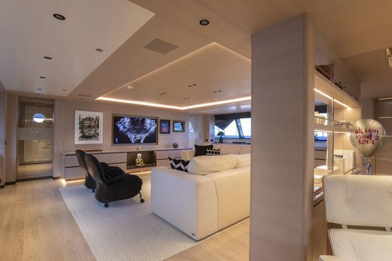 a living room with a large screen aboard CAOZ 14 Yacht for Sale