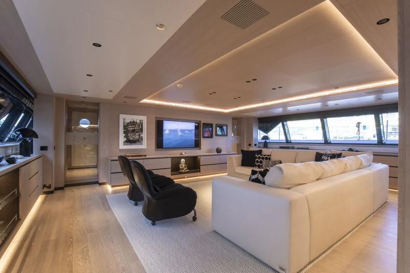 a living room with a couch and a tv aboard CAOZ 14 Yacht for Sale