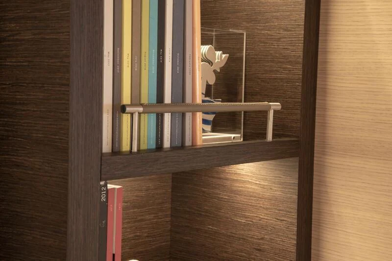 a book shelf with a white bird on it aboard CAOZ 14 Yacht for Sale