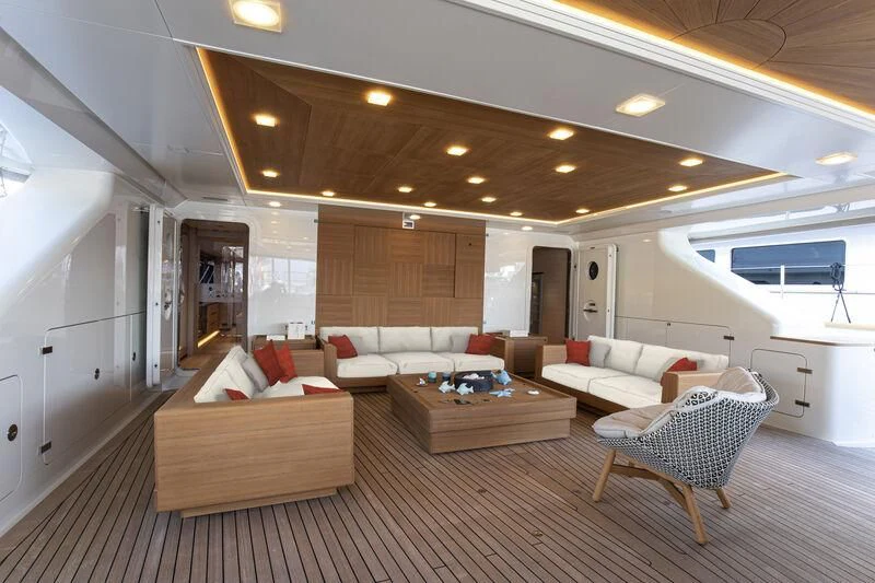 a living room with a large open window aboard CAOZ 14 Yacht for Sale