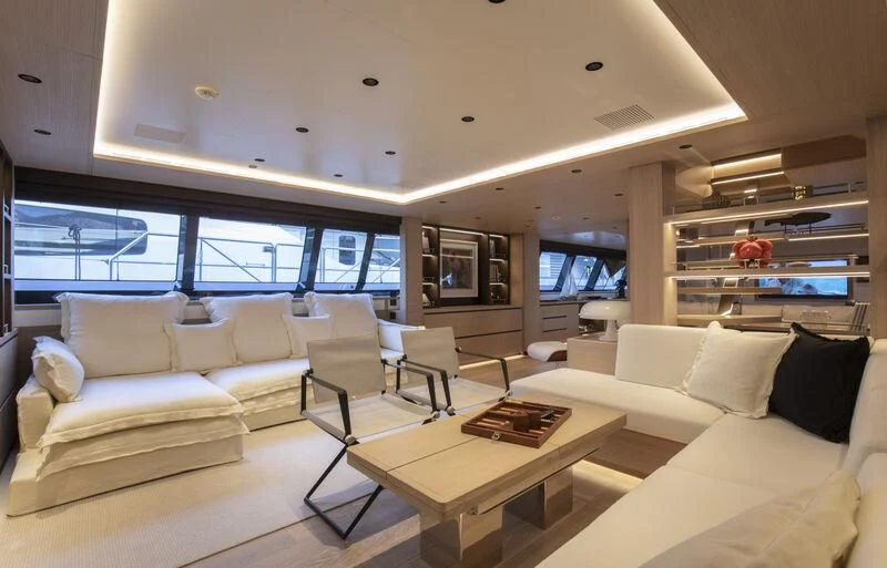 a living room with a large window aboard CAOZ 14 Yacht for Sale