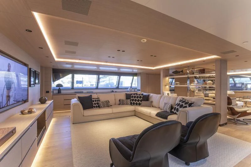 a living room with a large screen aboard CAOZ 14 Yacht for Sale