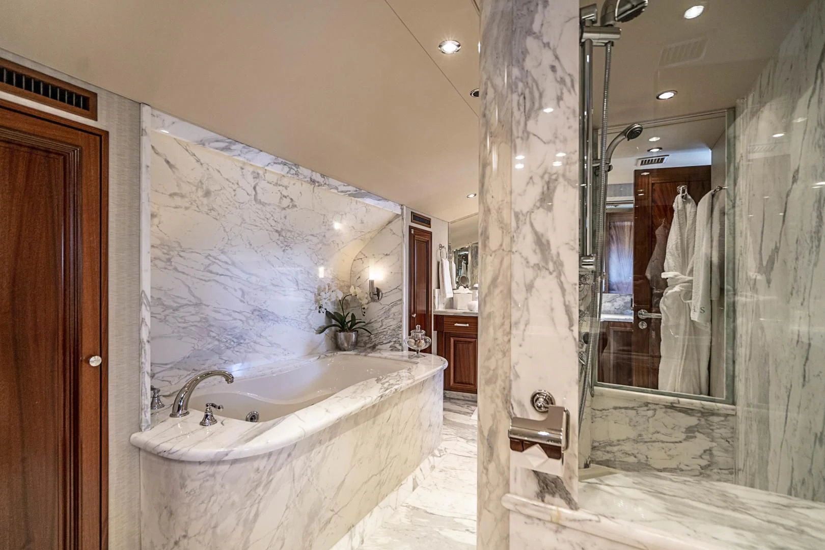 a bathroom with a bathtub and shower aboard ANTARES Yacht for Sale