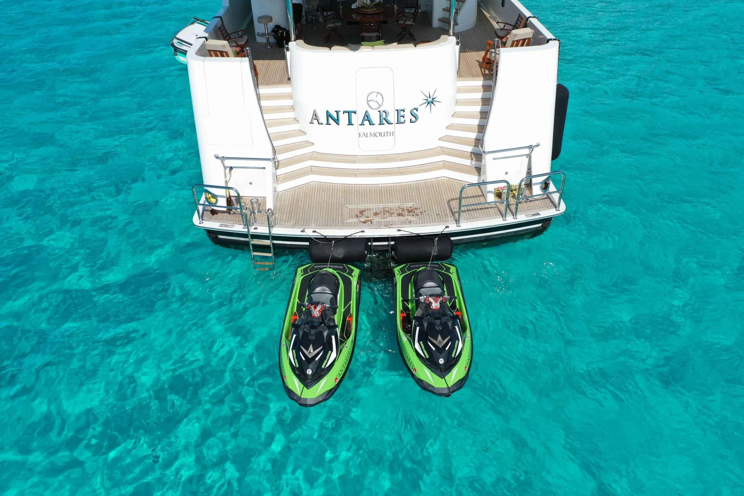 a white and green cart on a body of water aboard ANTARES Yacht for Sale