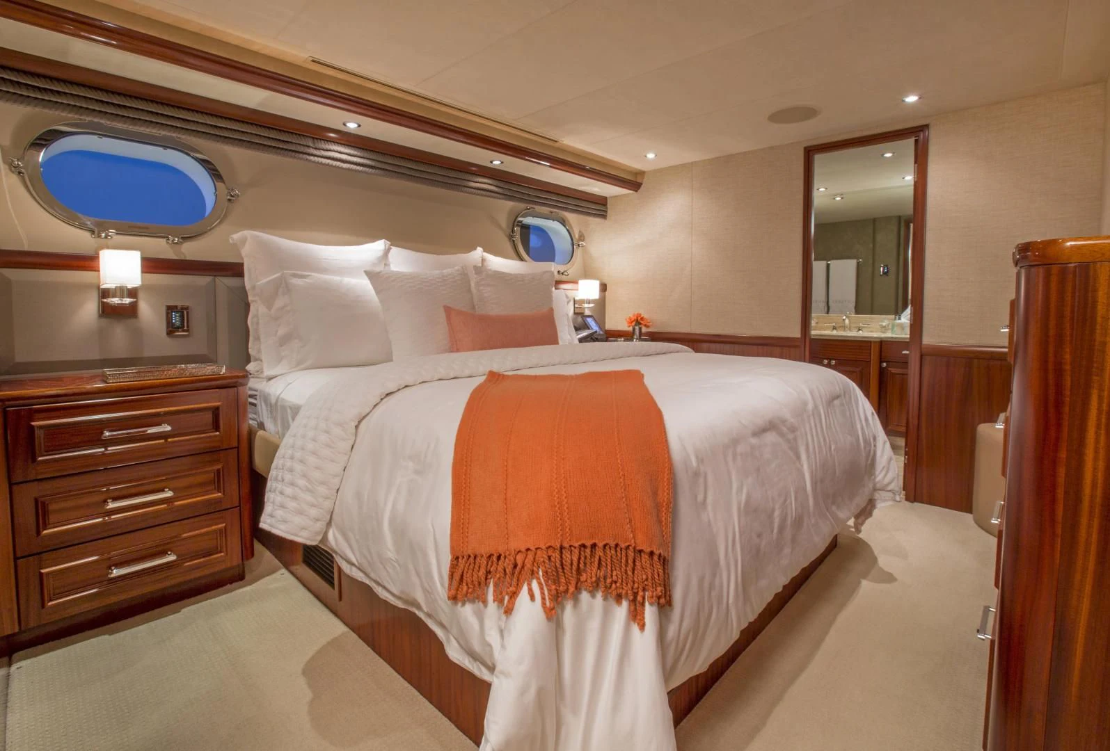 a hotel room with a bed and a mirror aboard ANTARES Yacht for Sale