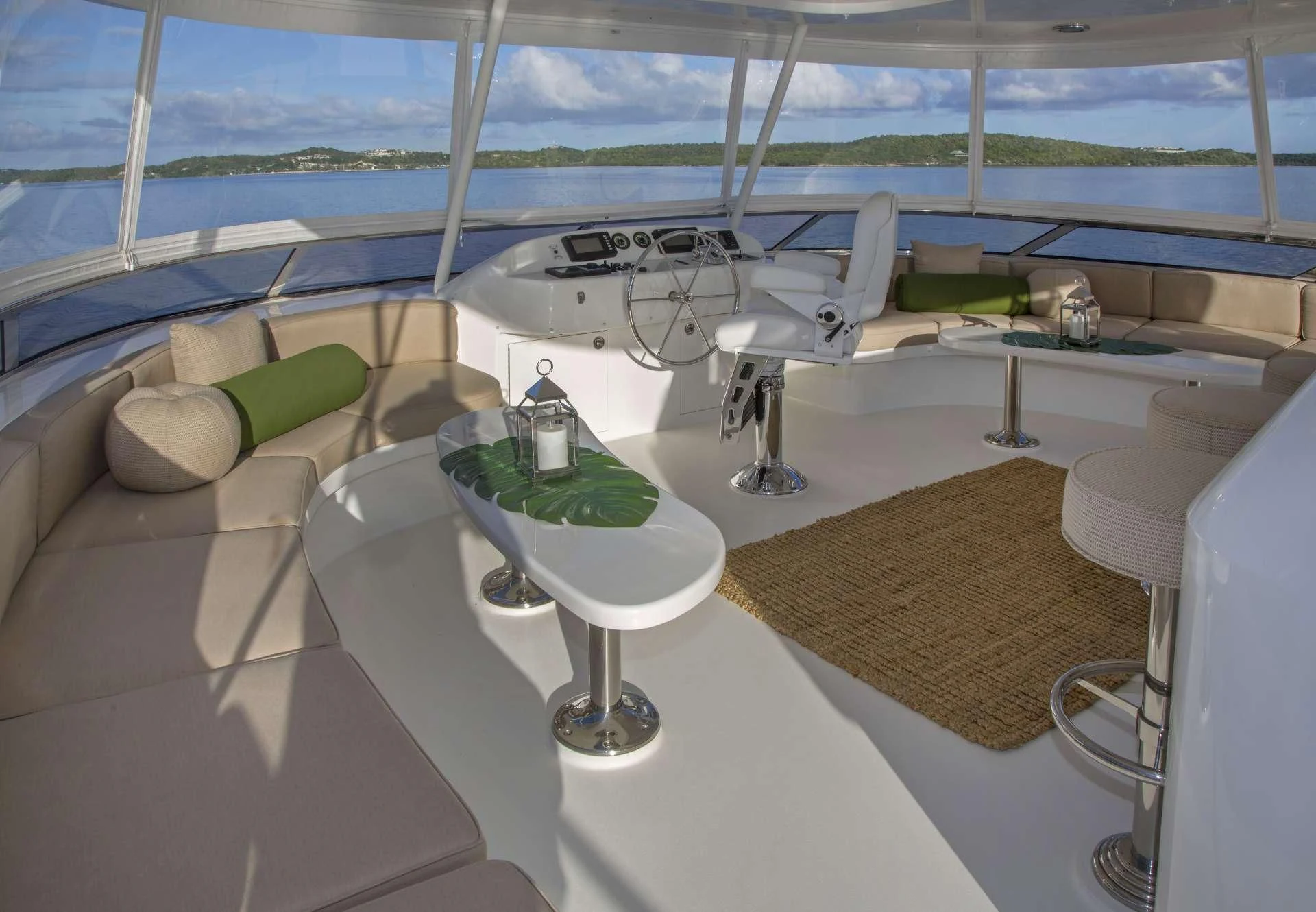 a room with a bed and a table with a fan aboard ANTARES Yacht for Sale