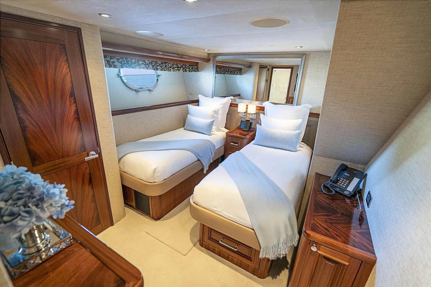a room with two beds aboard ANTARES Yacht for Sale