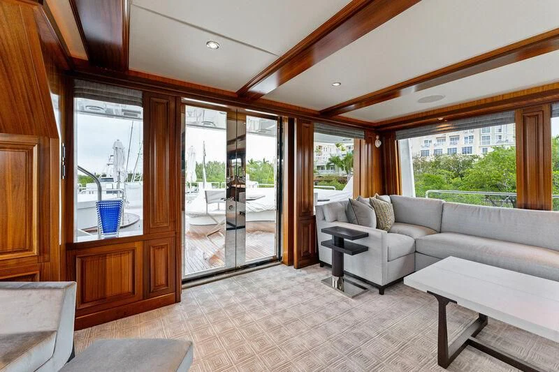a living room with a large glass door aboard ANTARES Yacht for Sale
