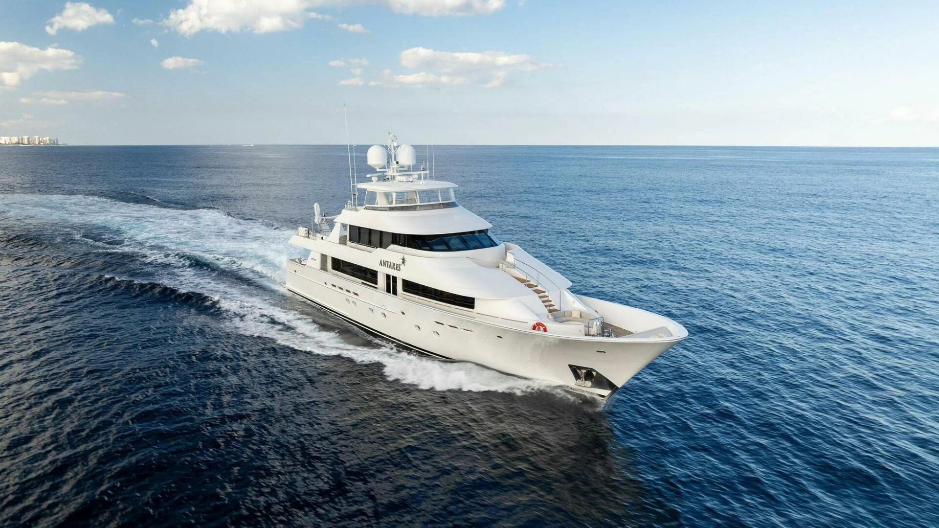 a white yacht on the water aboard ANTARES Yacht for Sale