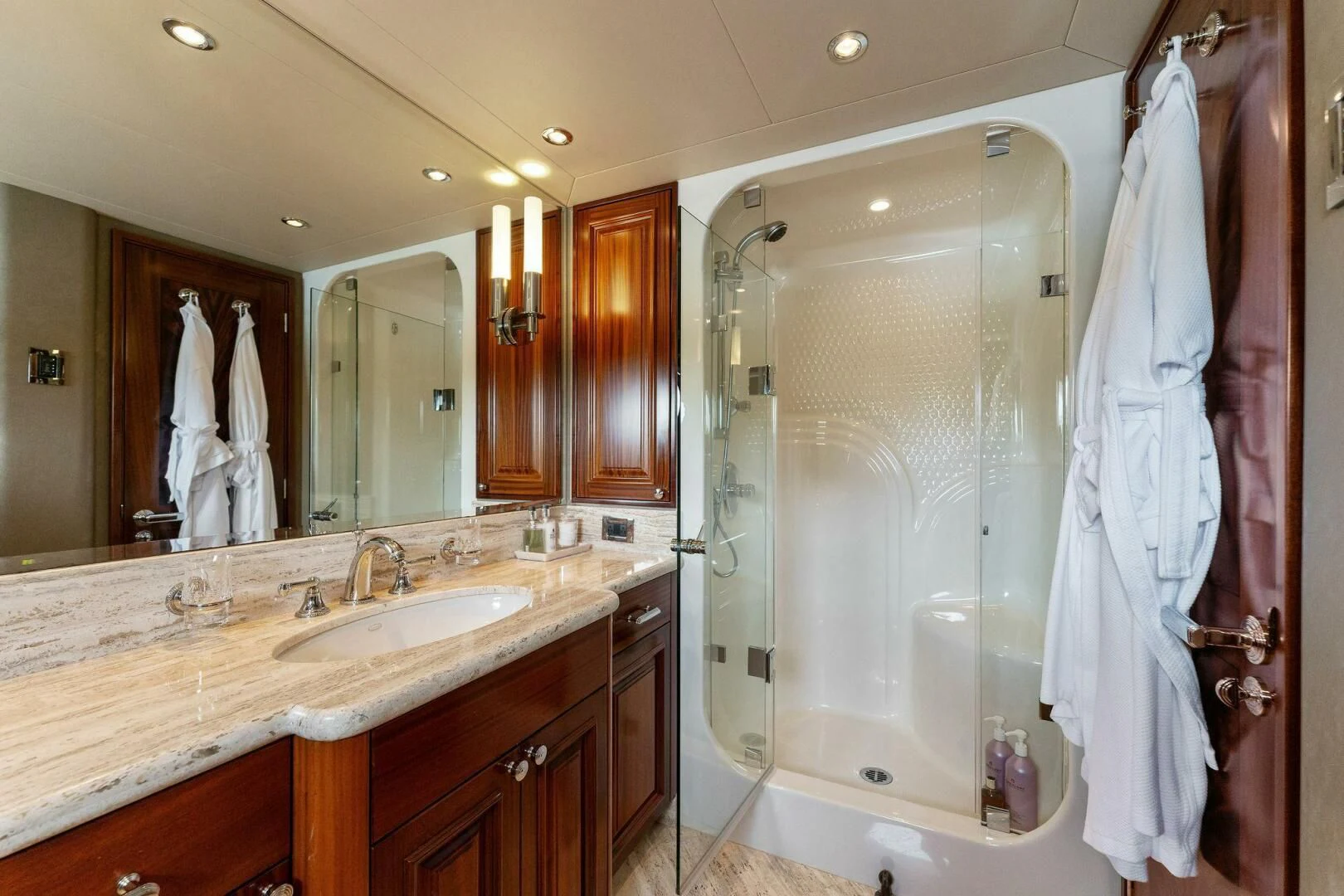a bathroom with a shower sink and a mirror aboard ANTARES Yacht for Sale