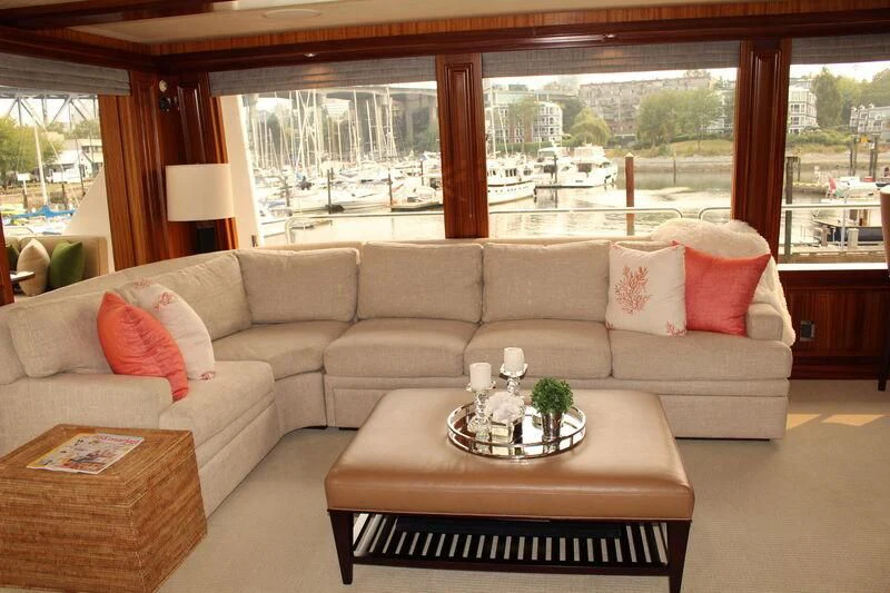 a living room with a couch and a table aboard ANTARES Yacht for Sale