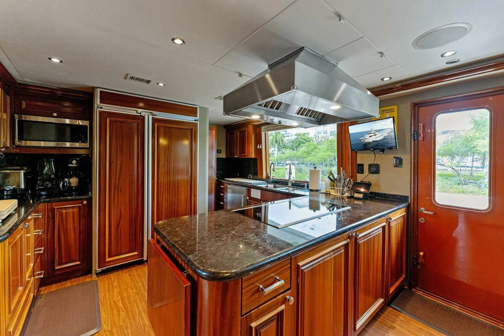 a kitchen with a large island aboard ANTARES Yacht for Sale
