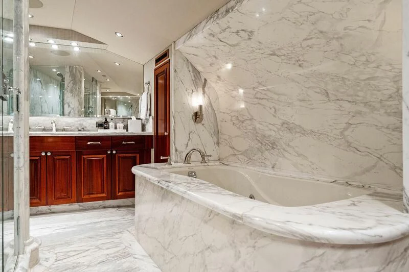 a bathroom with a bathtub and sink aboard ANTARES Yacht for Sale