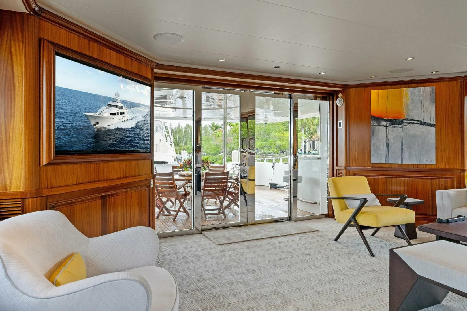 a living room with a sliding glass door aboard ANTARES Yacht for Sale