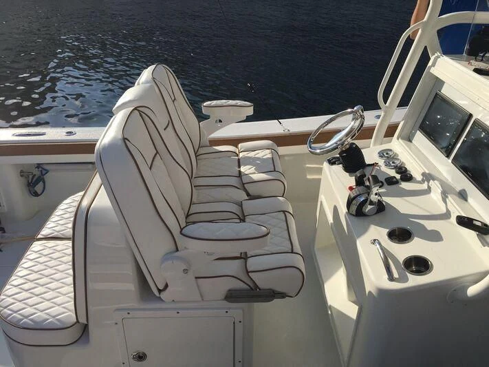 a boat with a seat and steering wheel on the front aboard ANTARES Yacht for Sale