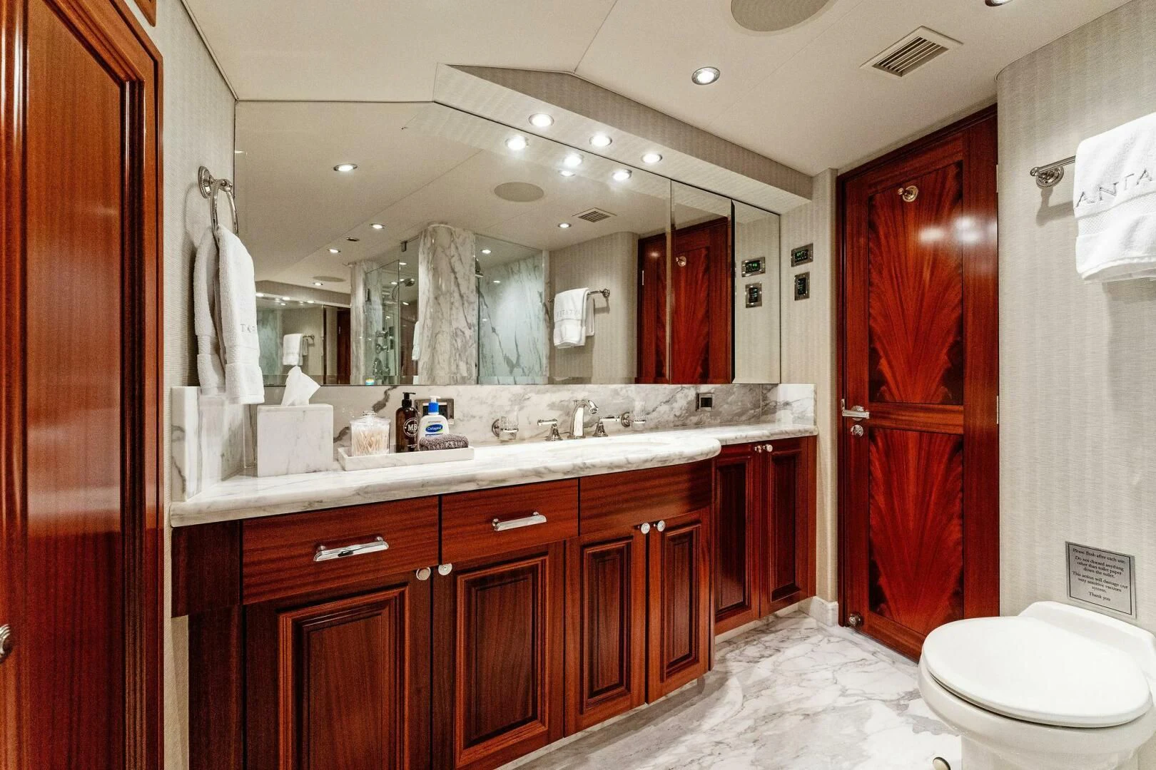 a bathroom with a large mirror aboard ANTARES Yacht for Sale