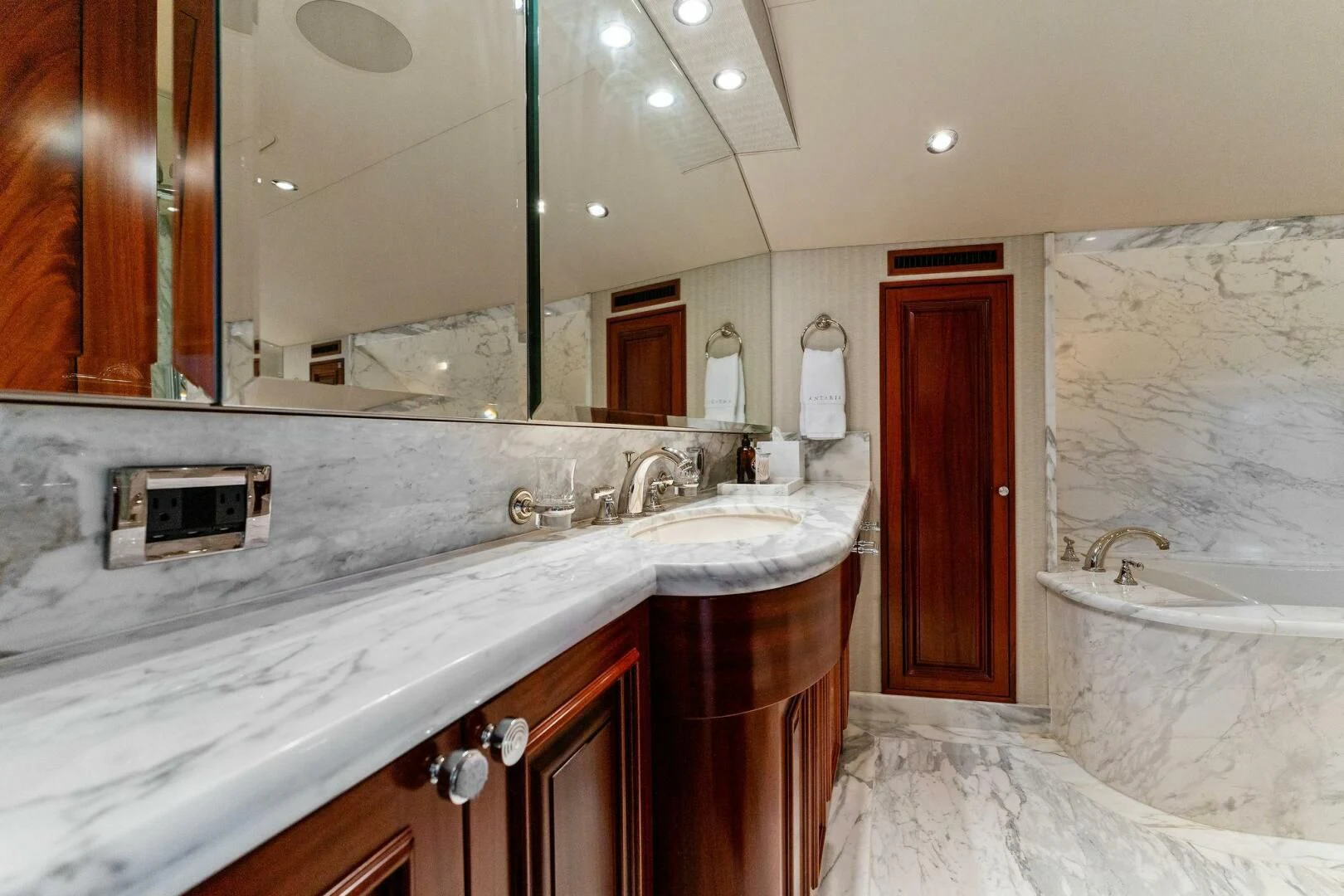 a bathroom with a large mirror aboard ANTARES Yacht for Sale