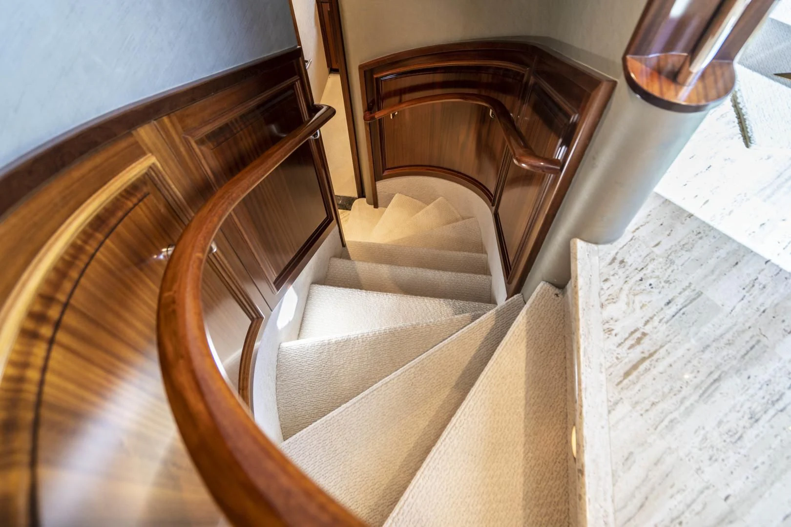 a staircase with a wood railing aboard ANTARES Yacht for Sale