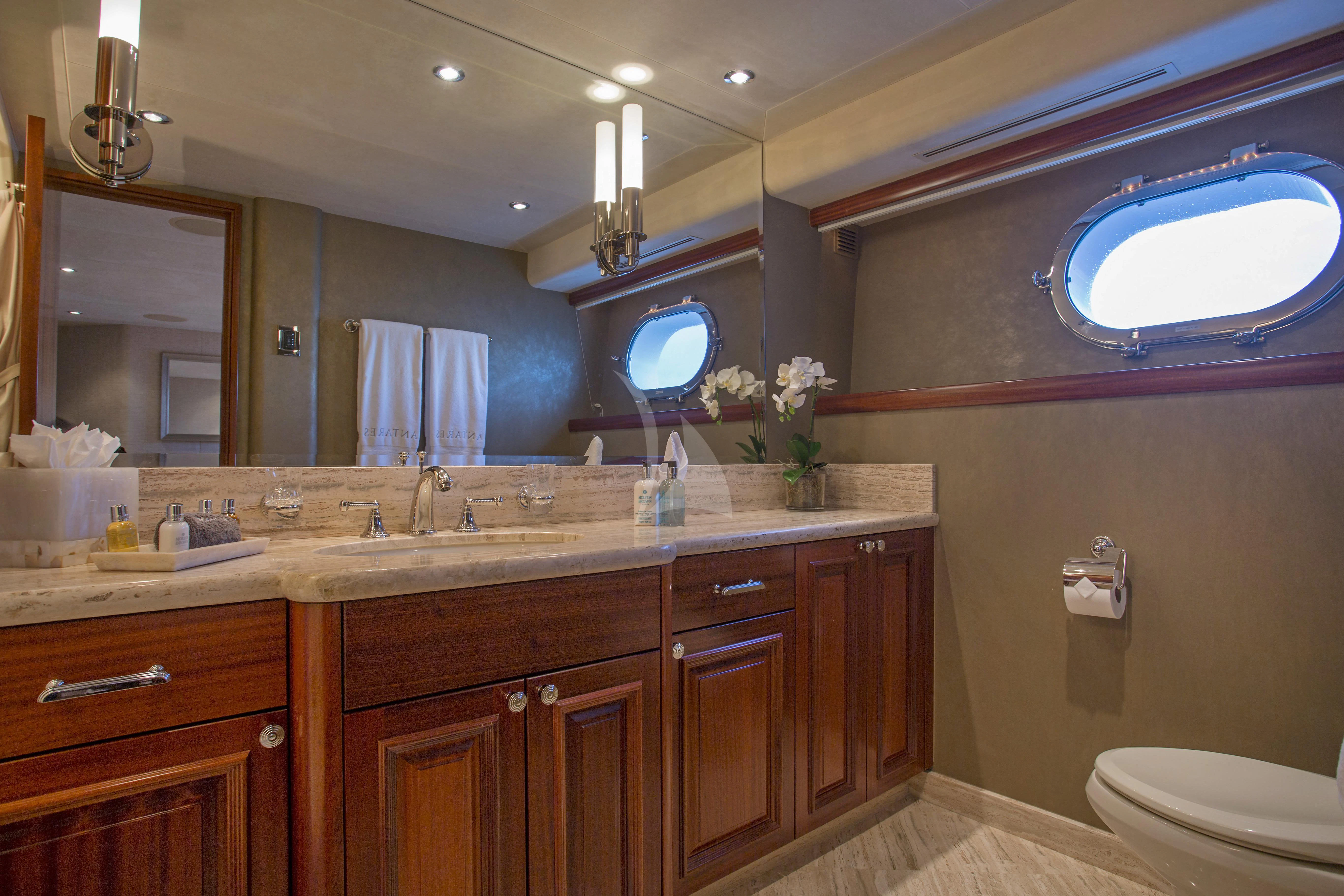 a bathroom with a large mirror aboard ANTARES Yacht for Sale