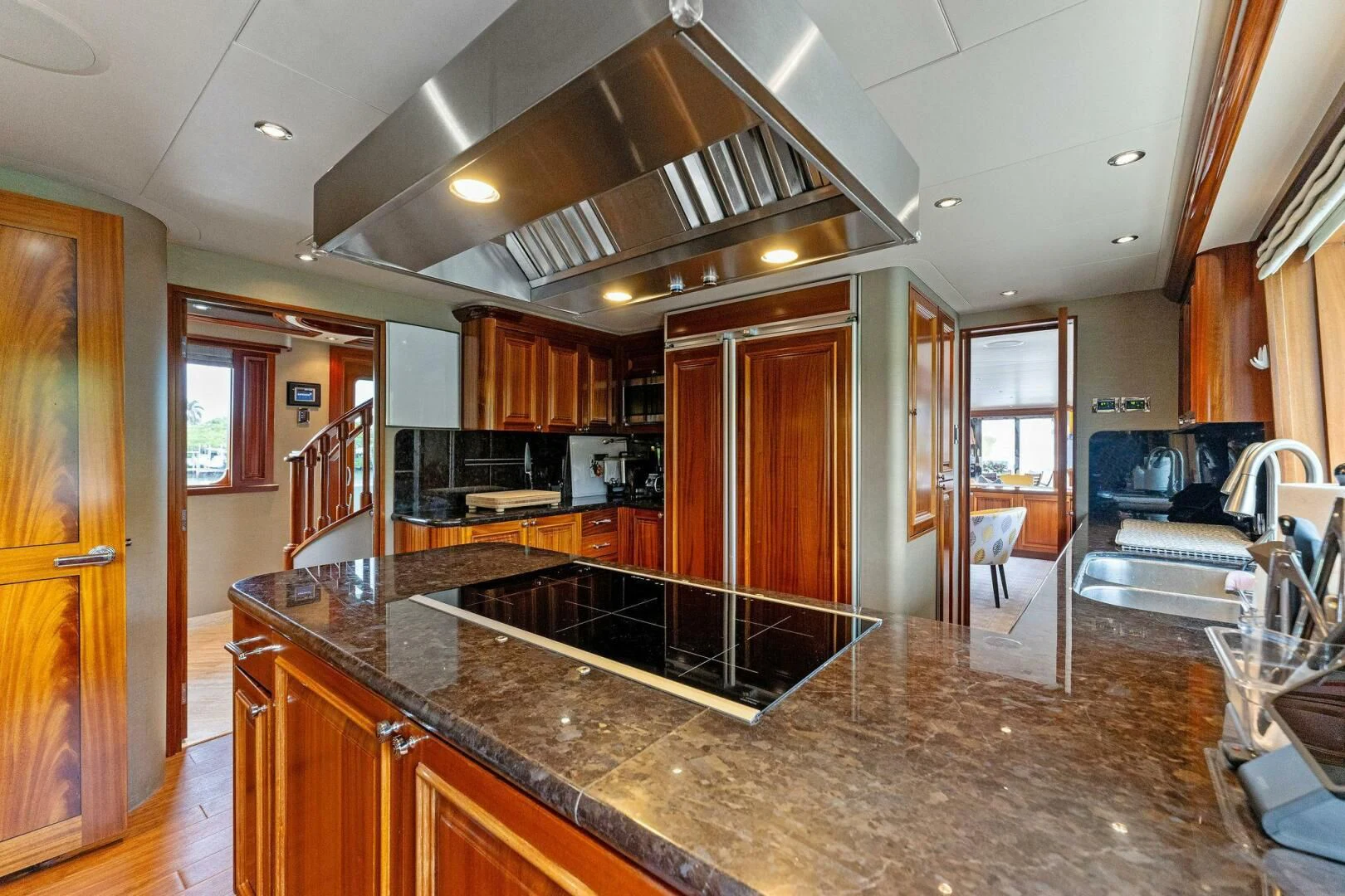 a kitchen with a large island aboard ANTARES Yacht for Sale