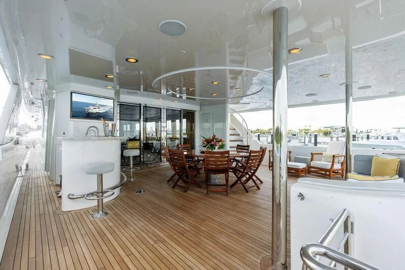a room with tables and chairs aboard ANTARES Yacht for Sale