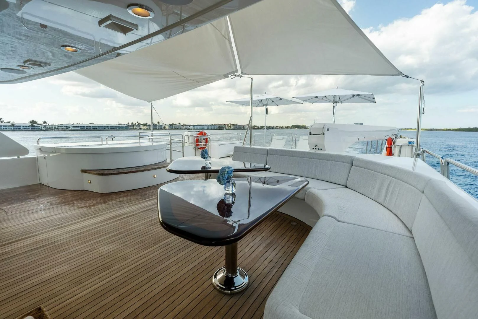 a boat with a table and chairs on a deck aboard ANTARES Yacht for Sale