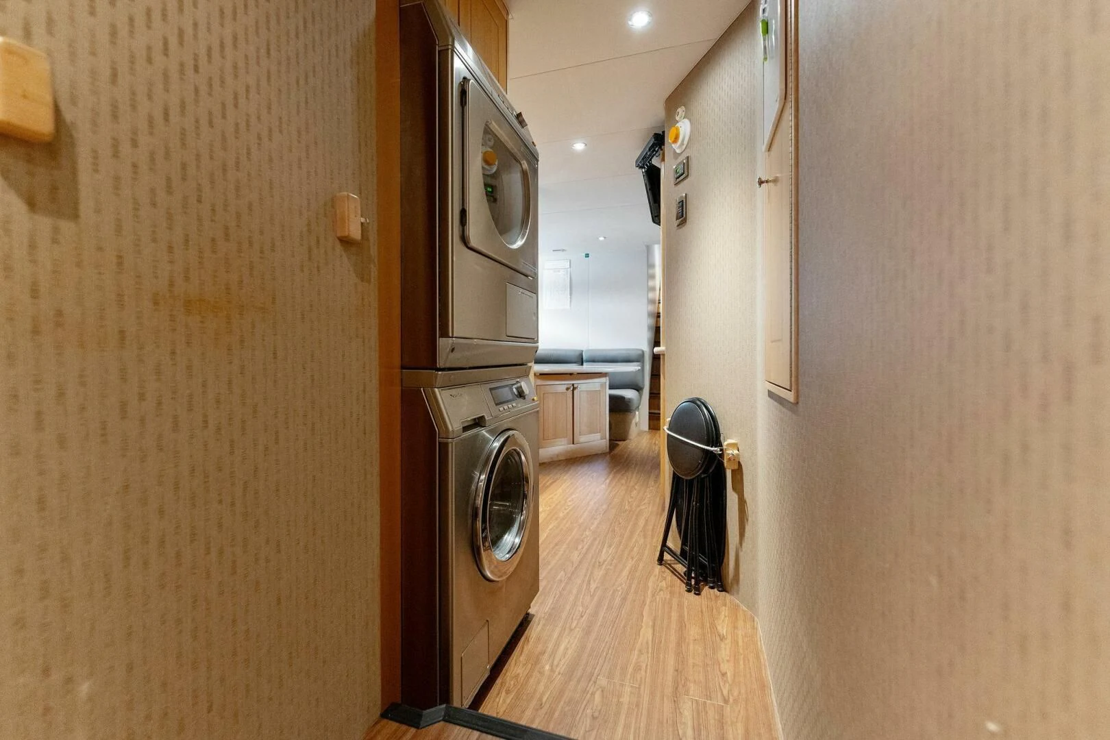 a room with a washing machine and dryer aboard ANTARES Yacht for Sale