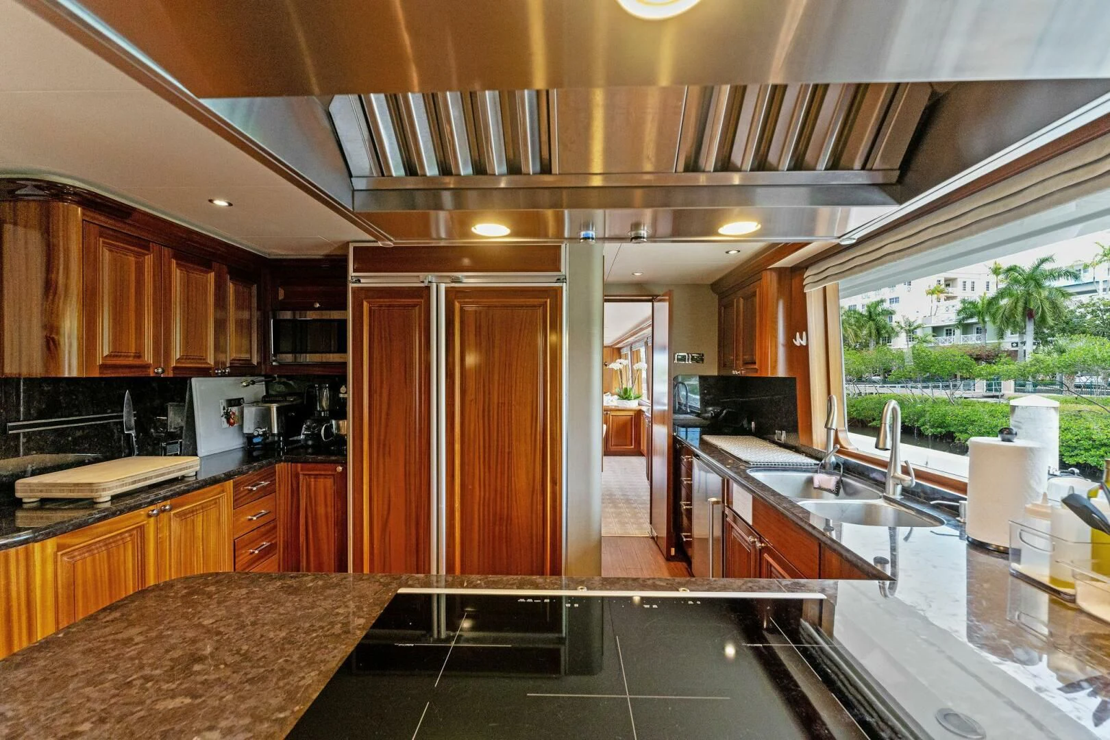 a kitchen with wooden cabinets aboard ANTARES Yacht for Sale