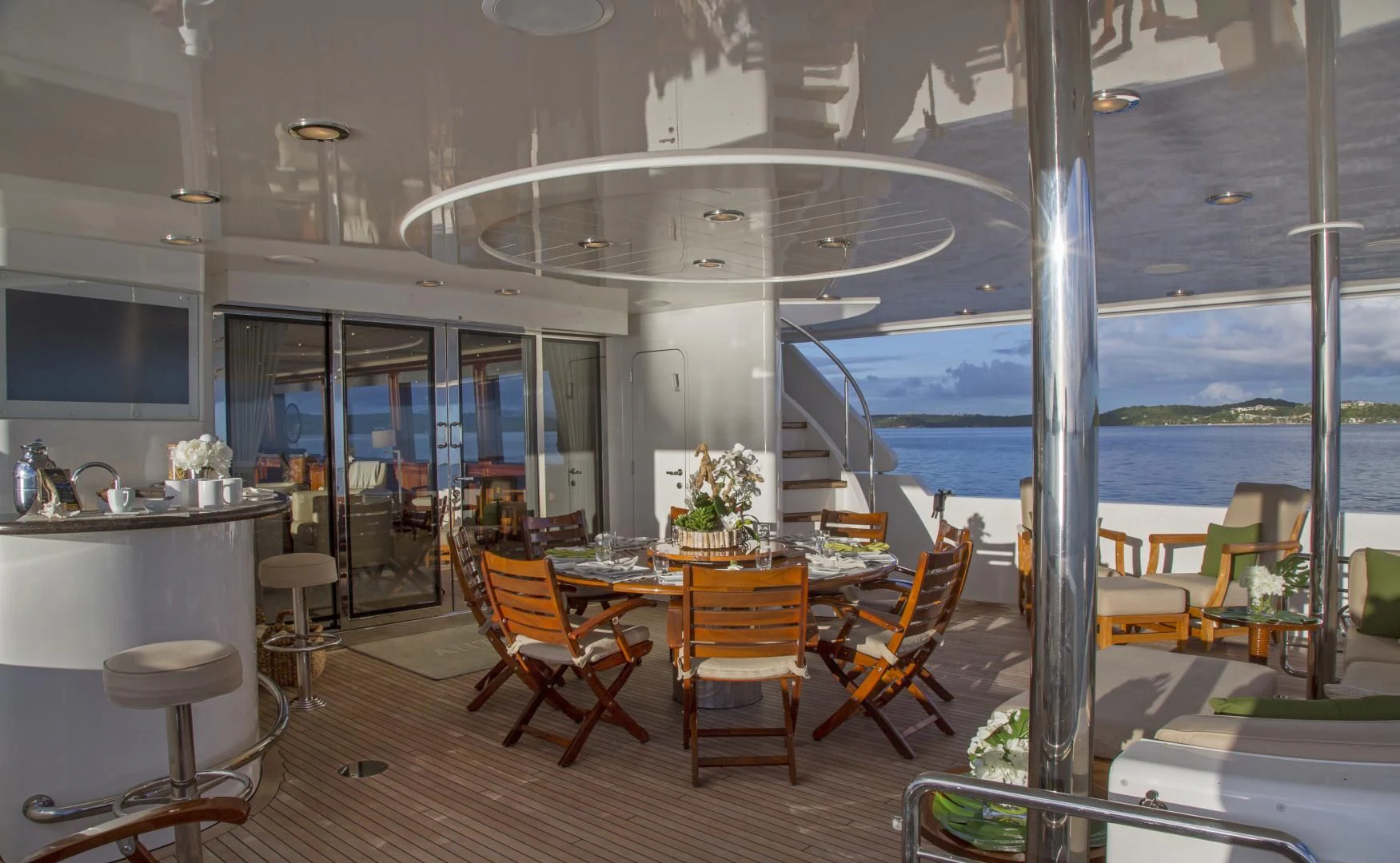 a room with a table chairs and a large window aboard ANTARES Yacht for Sale