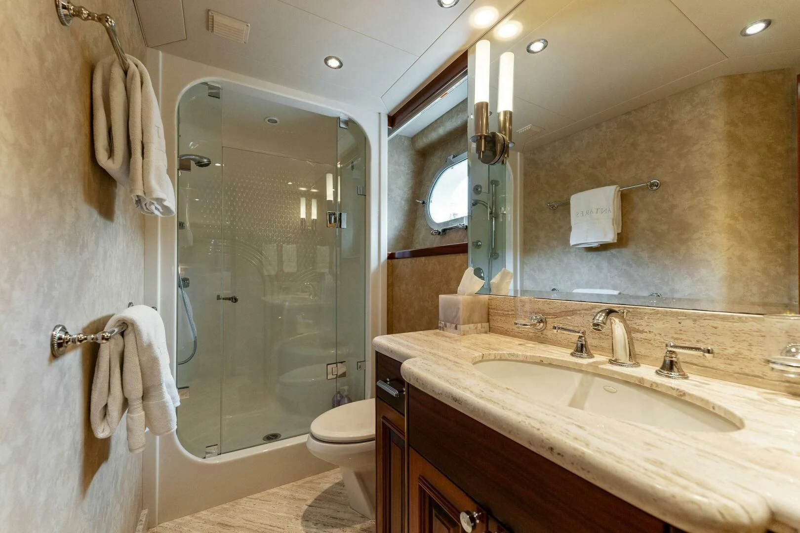 a bathroom with a glass shower door aboard ANTARES Yacht for Sale