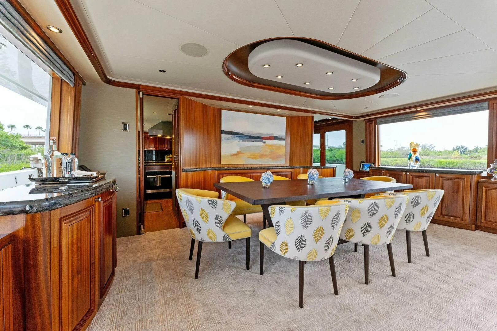 a kitchen with a table and chairs aboard ANTARES Yacht for Sale